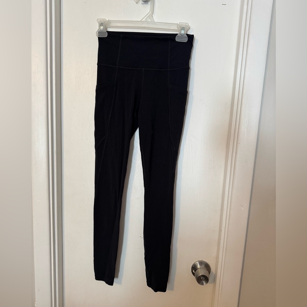 Athleta Black Stash Pocket Salutation Tights size XS